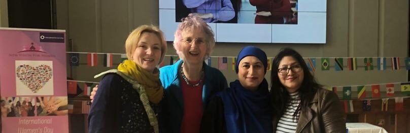 Four women at an event